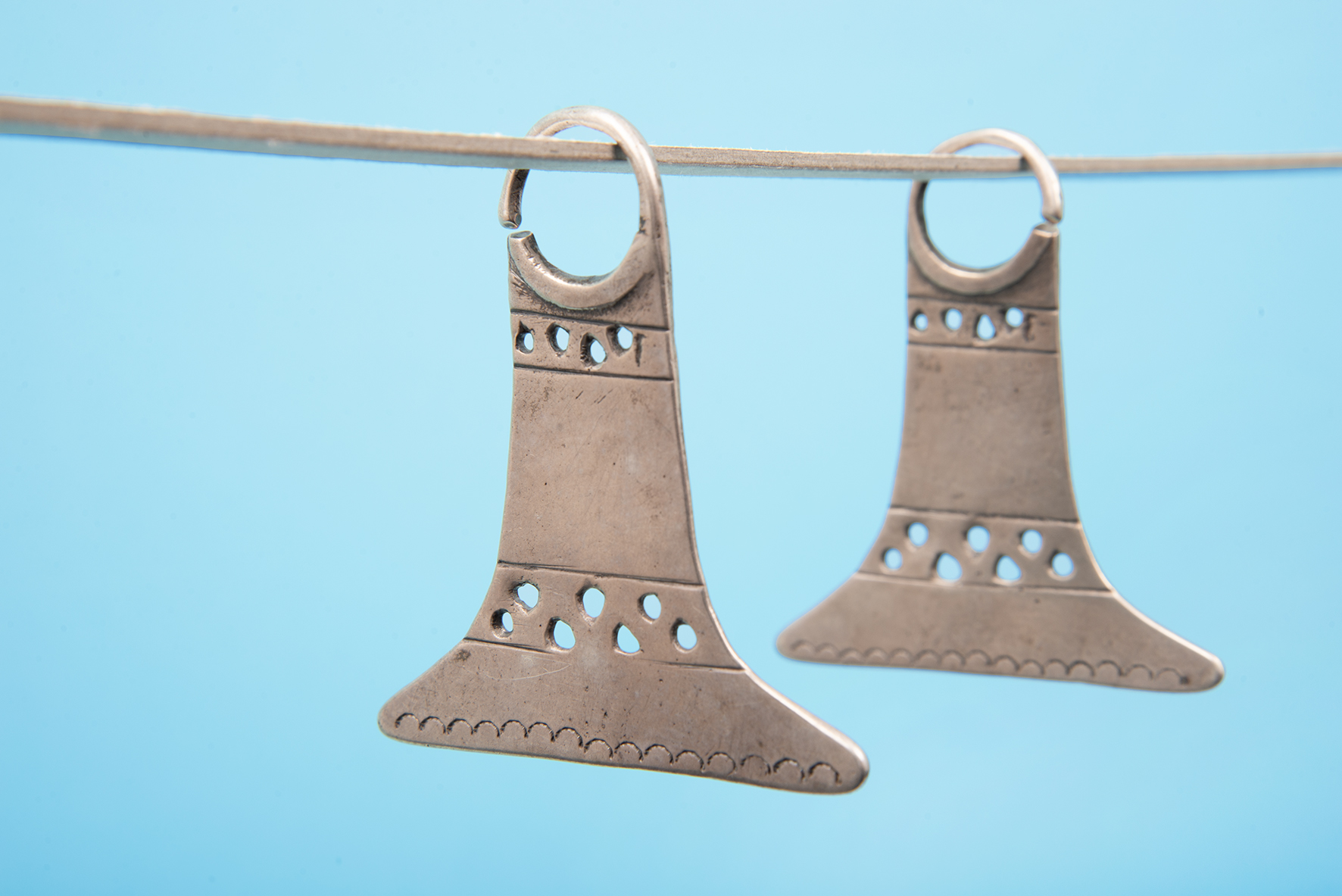 Earrings. Silver. Upül Chaway. Unknown artist | Mapuche, 1800–1900. MCHAP, 1288 a–b. Photograph by Justine Graham.